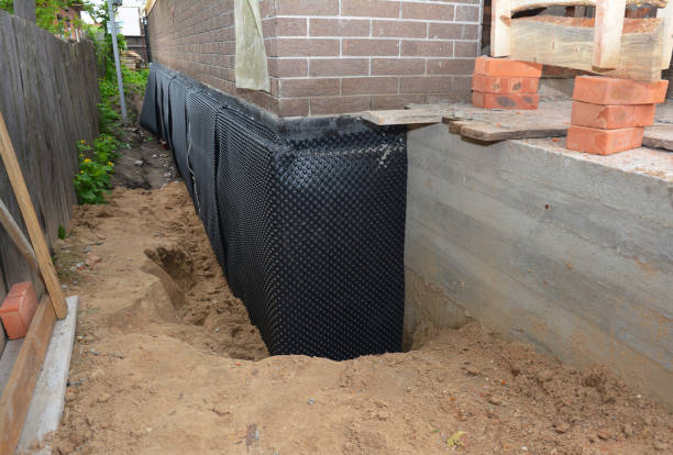 Happy homeowners after waterproofing job in Canton